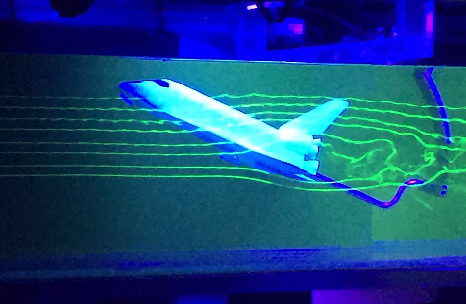 A simplified demonstration showing the fluid flow around a small-scale model of NASA’s space shuttle. 