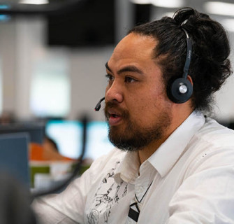 A profile picture of a dark haired man wearing a headset.