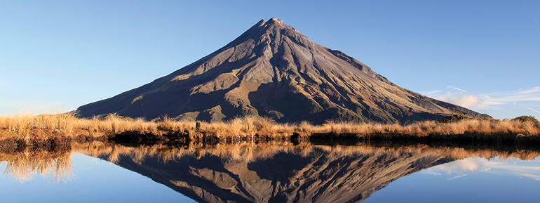 Mount Taranaki reflected in Pouākai Tarns – Pouākai Crossing