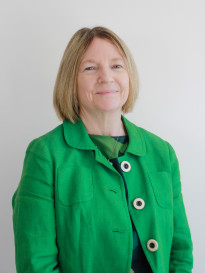 Cath Atkins profile pic wearing a green blazer