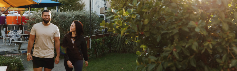 Photo of a couple walking in an outdoor location