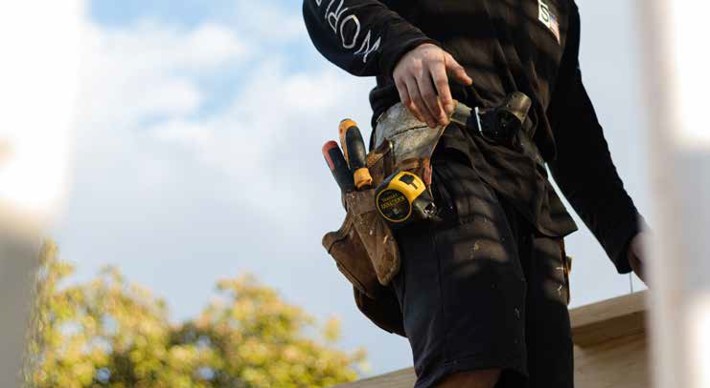 Cropped image of construction workers tool belt