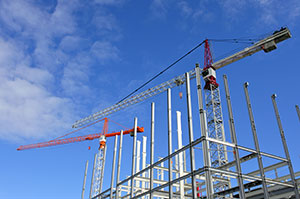 A building under construction with exposed steel framing