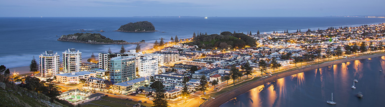 An aerial view of the Mount Manganui township at dusk