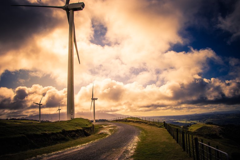 Large windmills on country road.