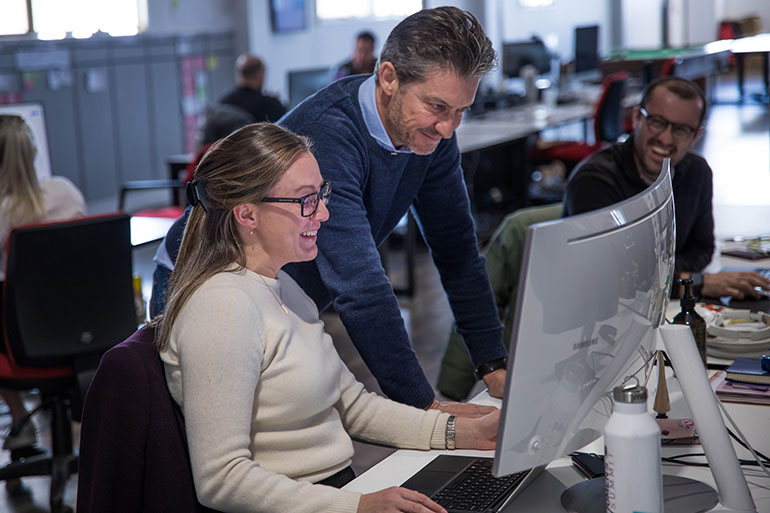 Two people at a desk