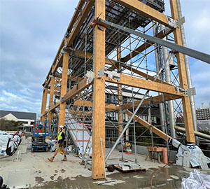 The exposed steel frame of a large building under construction