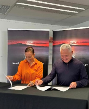 Woman and man read documents with a smile