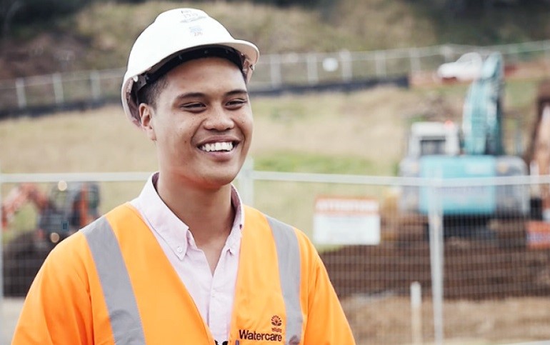 Male in Hard hat smiling. He is a civil engineer.