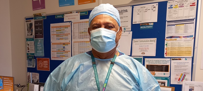 Mature person in surgical scrubs.