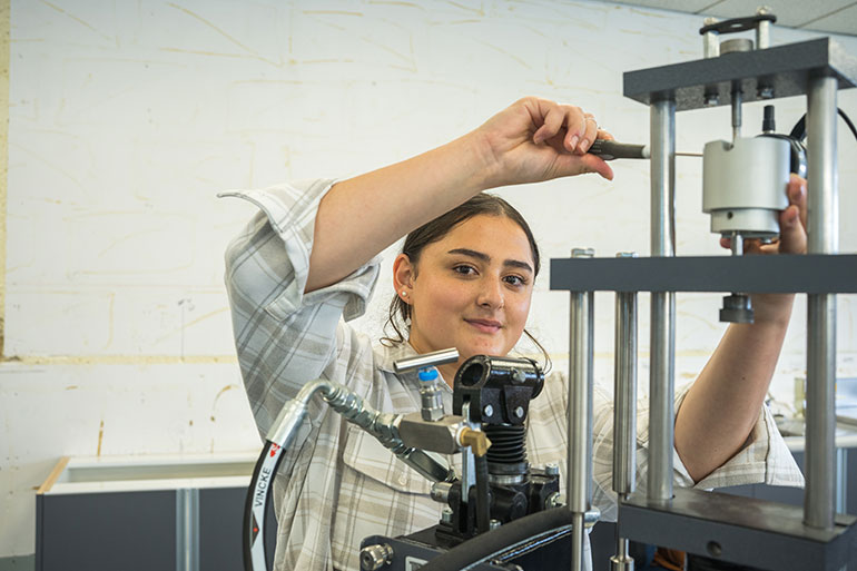 A young woman working at WITT.