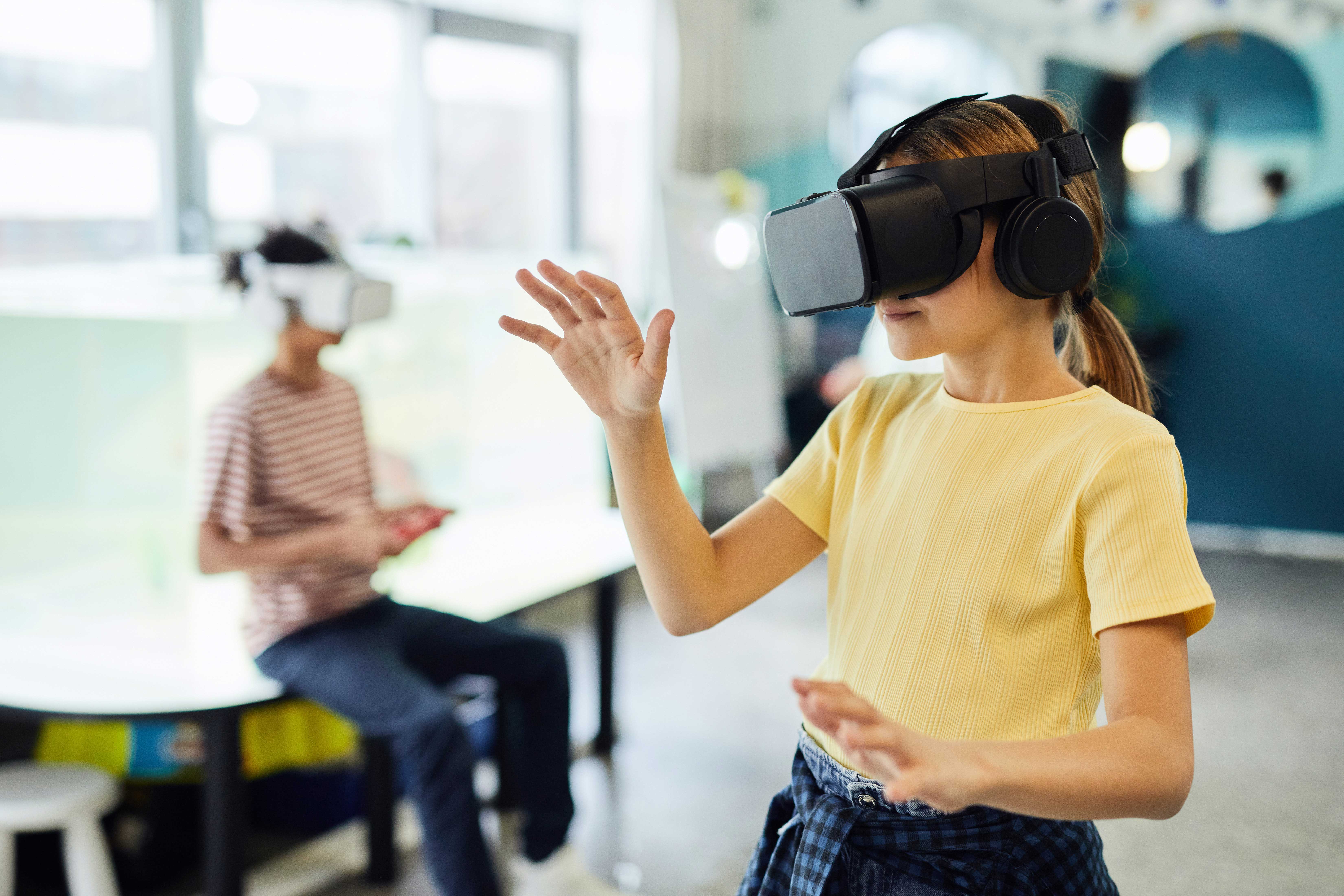 Young person wearing a Virtual Reality headset