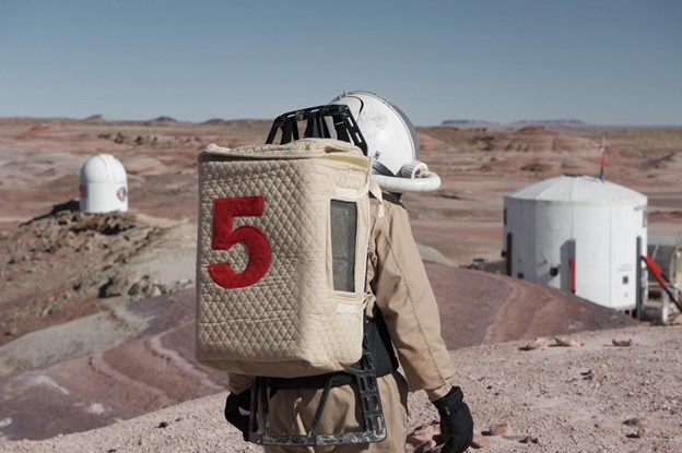 Back view if Hari wearing an astronaut suit at the Mars Desert Research Station in Utah in 2011.