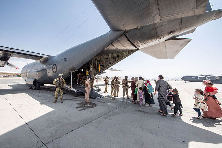 Royal New Zealand Air Force Hercules being loaded with evacuees from Hamid Karzai International Airport in Kabul, Afghanistan, August 2021.