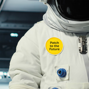 Astronaut suit with yellow sample mission patch on chest