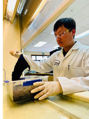 Research Scientist Dr. Yang Liu is seen here analysing the biodegradability of footwear during the various phases of its breakdown.