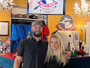 Gareth and Anne-Marie standing in their retail shop.