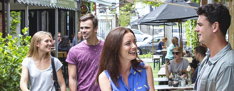 Two couples at an outdoor café complex