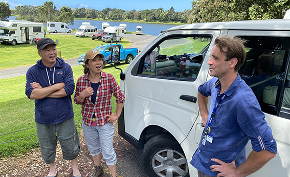 NPDC Freedom Camping Ambassador talking to freedom campers at Lake Rotomanu