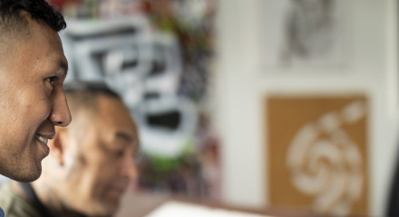 A man listens intently to a conversation